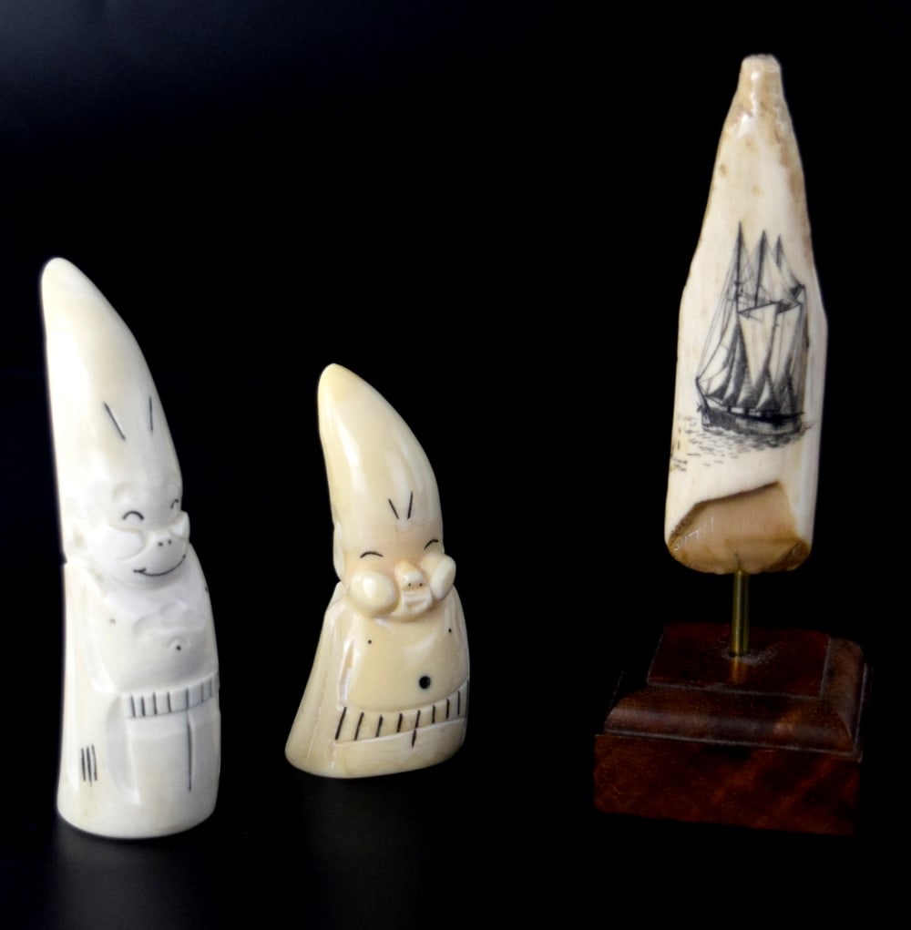 Group Eskimo Inuit Whale Carvings Scrimshaw And Pair Billikens: Great group of Native Alaska Eskimo Inuit whale carvings. Fine scrimshaw depicting sailing ship and pair of Billikens.Carving of billikens by Alaskan Natives began in the early 1900s and continues to 