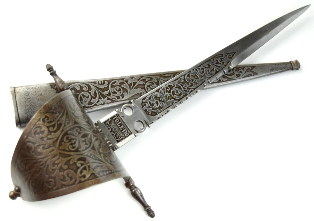 Great Quality 19th C. Spanish Toledo Mein-Gauge Left Hand Dagger with Fine Chiseled Steel Blade: Great Quality 19th C. Spanish Toledo Mein-Gauge Left Hand Dagger with Fine Chiseled Steel Blade Decorations, Etched Steel Scabbard and Large Sail Guard. Total length (inside scabbard if present): 17 1