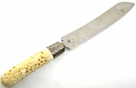 Burmese carved handle knife with carved Silver guard and decorated handle