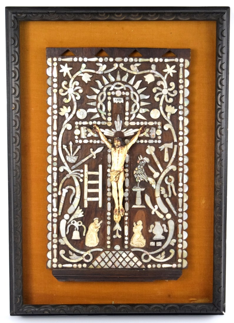 Spanish Colonial Antique Carved Bone Crucifix Surrounded By Mother Of Pearl Decor: Rare exclusive Spanish Colonial antique wall art carved bone crucifix reliquary surrounded by carved mother of pearl decoration. Great details. Hard to find antique piece of history. Size: Framed: 22