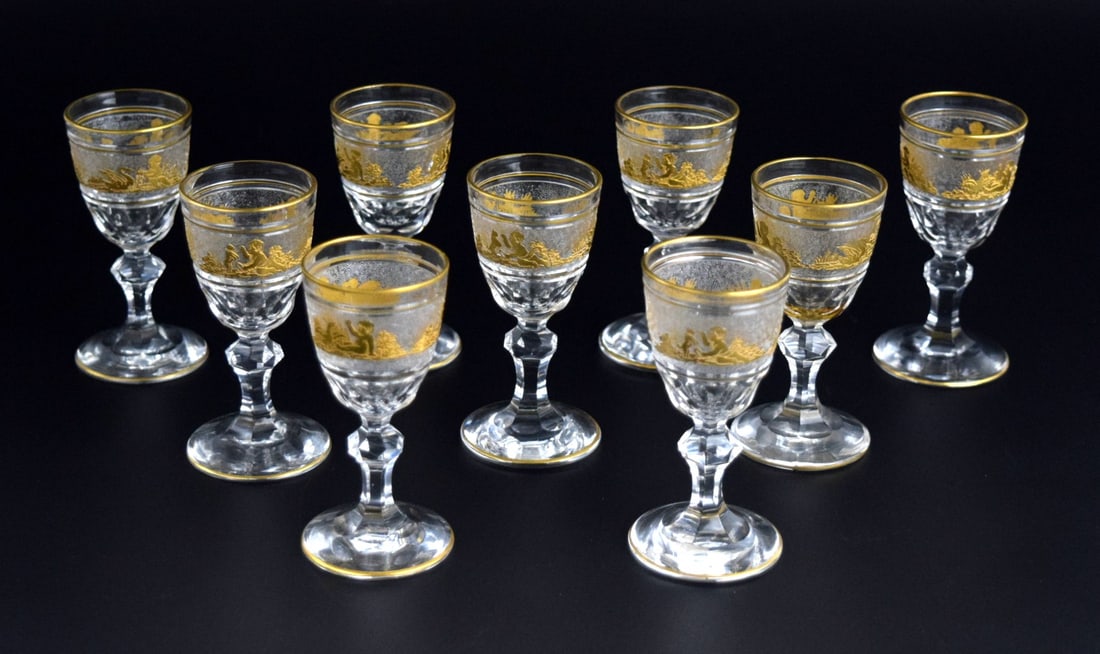 9 Val St Lambert Danse de Flore Gold Crystal Glass Water/Wine Goblets: Beautiful set of 9 crystal glass water or wine goblets made by St. Val Lambert. This set is in the Danse de Flore pattern. The body of each cup is textured and is hand painted with golden genre scenes