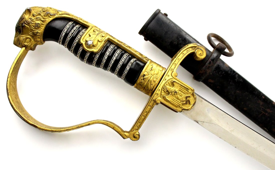 Very Good German WW II Officer's Sword in Gold Gilt Mounts with Ruby Eyes Puma Head Pommel. Carl: Very Good German WW II Officer's Sword in Gold Gilt Mounts with Ruby Eyes Puma Head Pommel. Carl Eickhorn Maker Marked. Total length (inside scabbard if present) : 37", Blade length : 31". ~ . Detaile