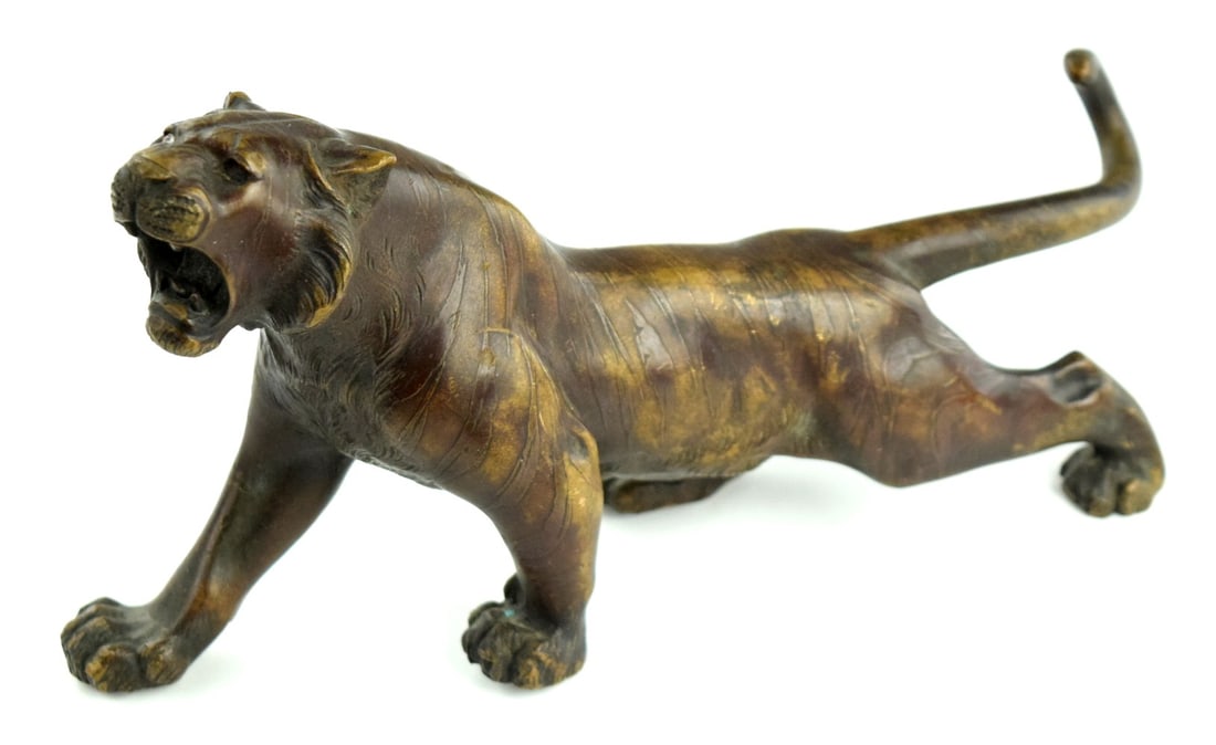 19th Century Japanese Okimono Bronze Tiger Sculpture: Very fine Meiji period Japanese bronze okimono depicting tiger. The bronze is very well modeled with nice details on the face and paws, it is signed with a two character artists signature on the base.