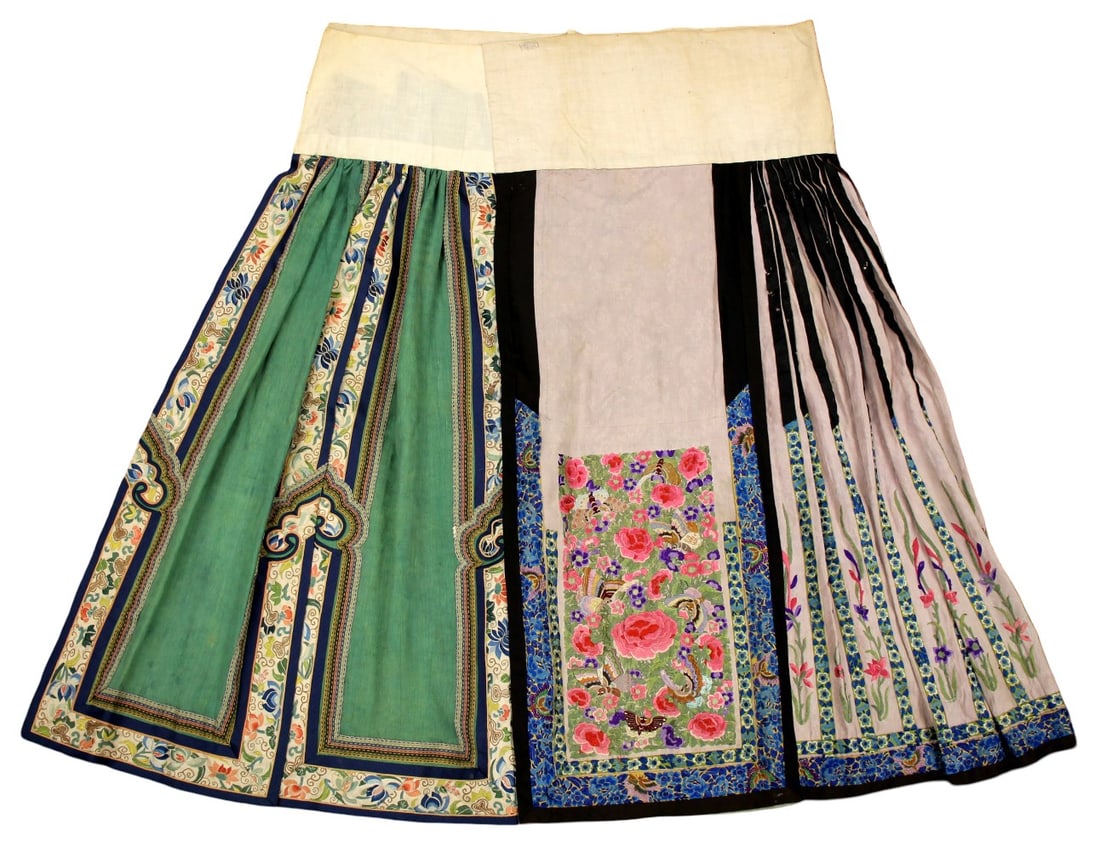 Late Qing Dynasty Embroidered Satin Skirt with Peony Design: Chinese late Qing Dynasty embroidered satin skirt, with a central floral design featuring a large peony with Peking knot detailing, with additional floral sprays and butterflies, accented with ribbon