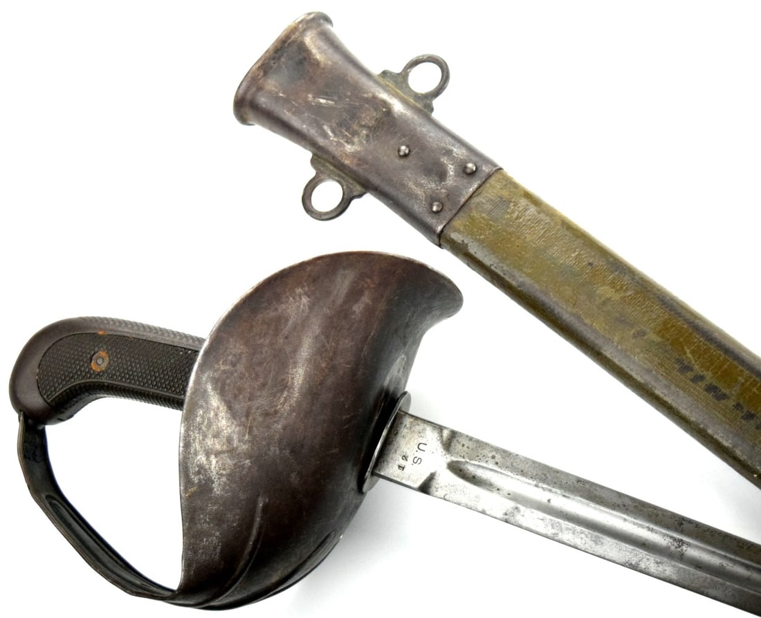 US World War I Model 1913 Patton Cavalry Saber: US World War I Model 1913 Patton Cavalry Saber. The saber is in standard M1913 configuration and is marked "S. (ordnance bomb) A. / 1918" on the ricasso. Total length (inside scabbard if present)