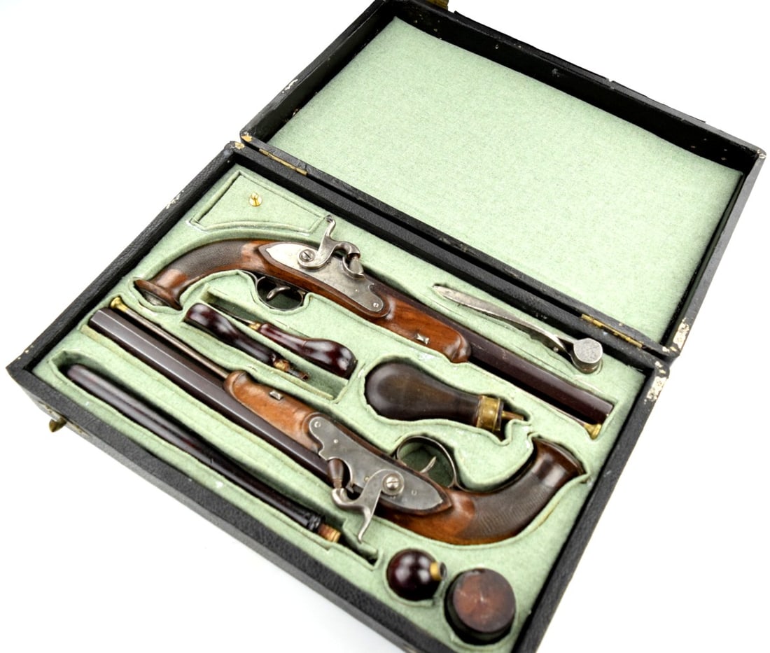 Cased Pair Of Liege ManufacturedÂ Percussion Dueling Pistols With Accessories Circa 1840: Cased Pair Of Liege ManufacturedÂ Percussion Dueling Pistols With Accessories Circa 1840 . Case Size: 16" x 10 3/4". ~ Detailed condition reports are not included in this catalog. For additional info