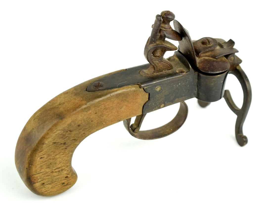18th-19th c English flintlock tinder lighter: 18th-19th c English flintlock tinder lighter. Total length: 5 1/2". ~ . Detailed condition reports are not included in this catalog. For additional information, including condition reports, please con