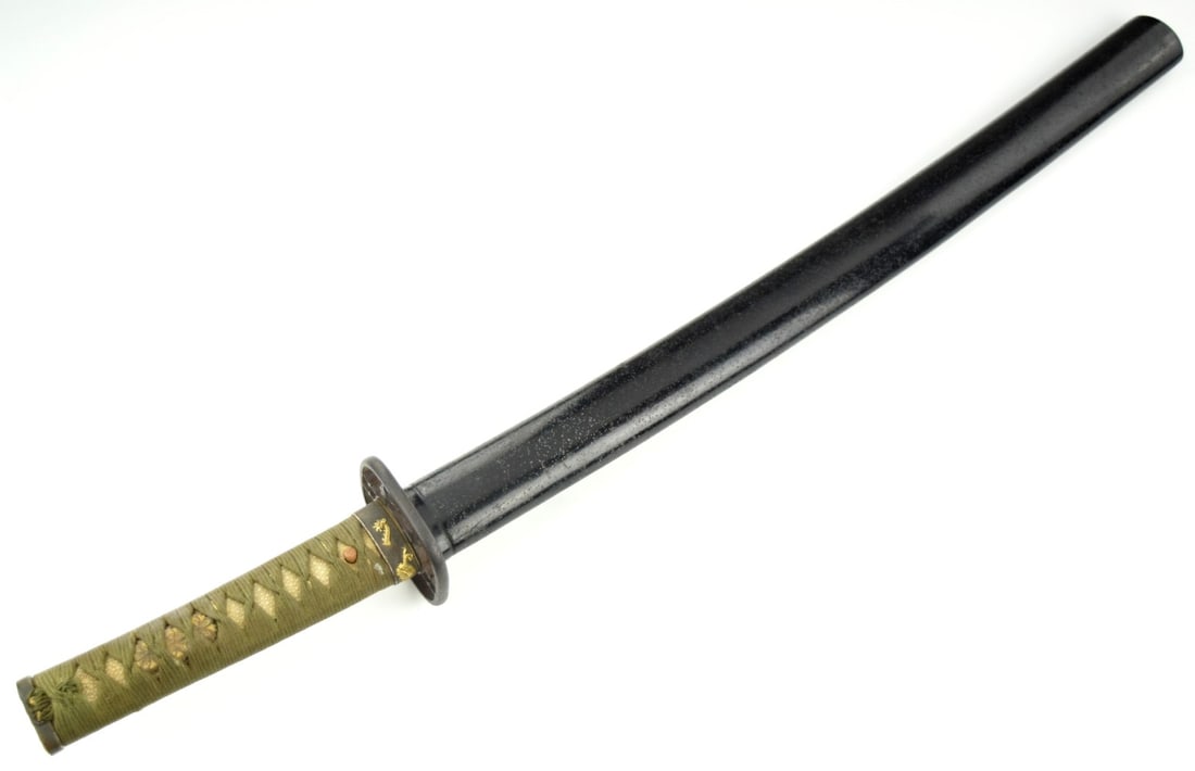 Late Edo Period Japanese wakizashi mounted in traditional style with a black lacquered saya: Japanese wakizashi mounted in traditional style with a black lacquered saya and olive-green tsuka-ito wrap over samegawa (ray skin) panels. The mount features an iron sukashi (openwork) tsuba with sep