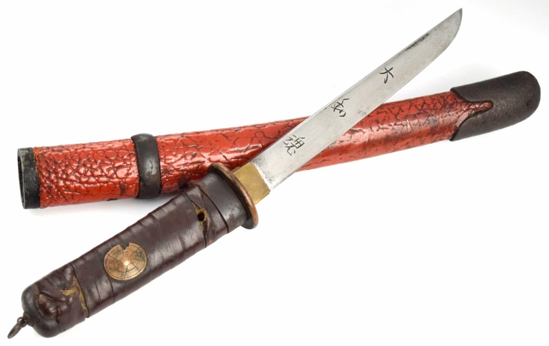 Shinshinto tanto, with hira-zukuri construction, signed Kaneuji Saku, ca. 1800s.: Shinshinto tanto, with hira-zukuri construction, signed Kaneuji Saku, ca. 1800s. The 7 inch blade shows a Mino style togari gunome hamon as well as horimono carvings on the blade. The blade is well mo