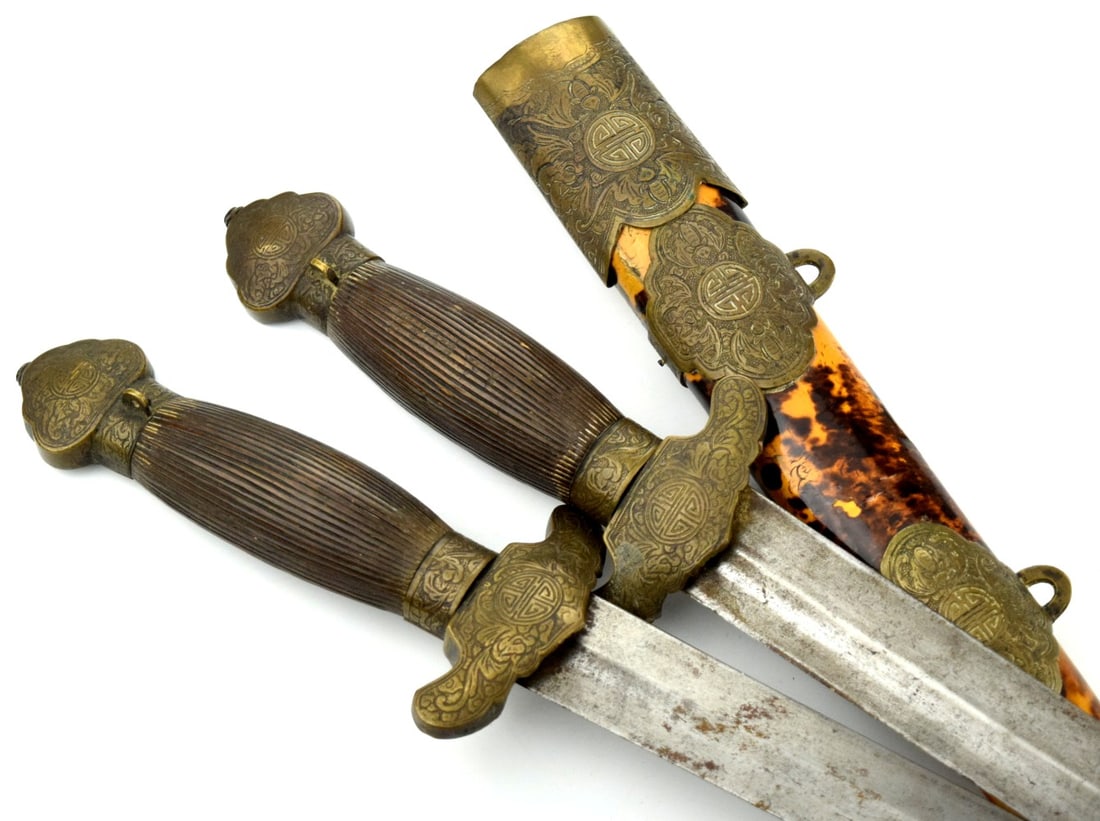 Chinese double sword South China 19th century: Pair of antique Chinese double short swords, known in Chinese as Shuangjian. They are designed to fit together side-by-side into a single scabbard, appearing as one when sheathed . These types of swor