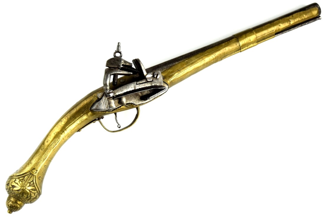 18thâ??19th Century Albanian Miquelet Flintlock Pistol â?? Brass-Mounted, Engraved, with: Large Albanian flintlock pistol of the miquelet type, 18thâ??19th century, featuring a long barrel and richly decorated brass-mounted stock. The stock and mounts are embellished with engraved foliate