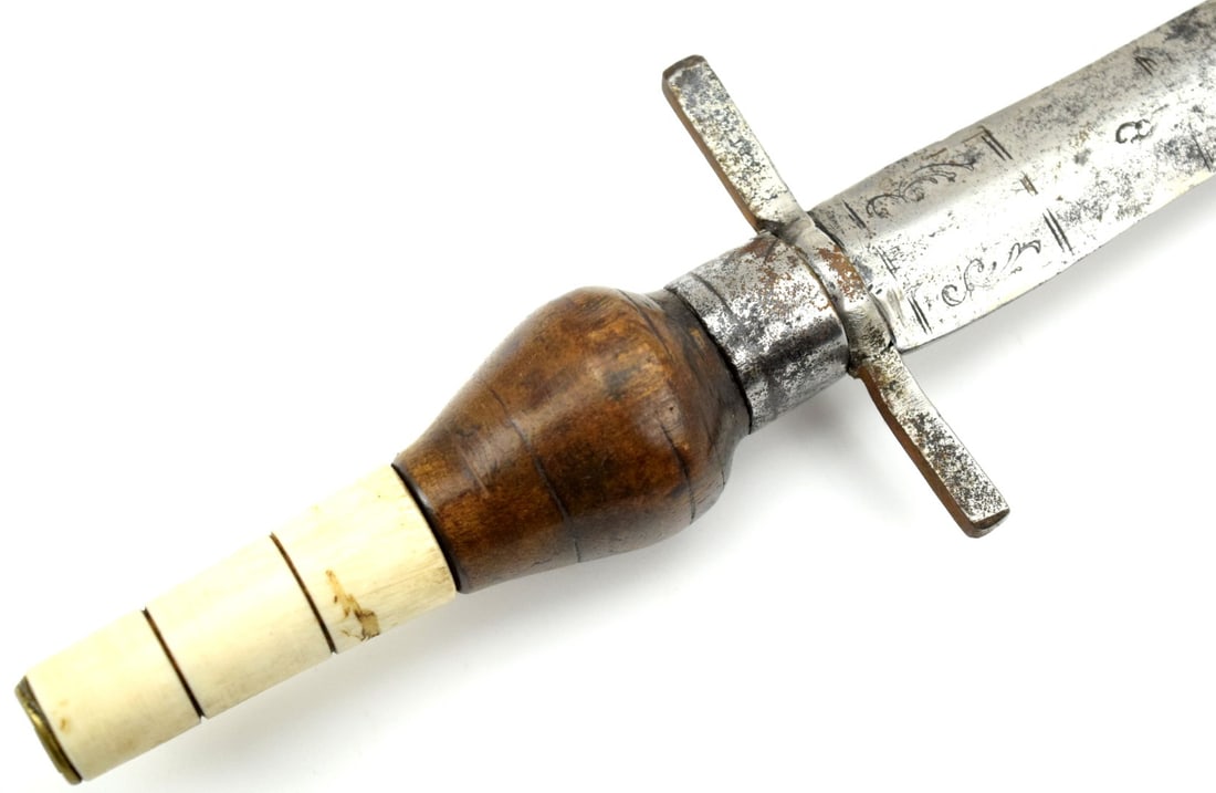 Nice 18th Century Italian or Spanish Plug Bayonet: With iron guard, ferrule and pommel cap and turned wood and bone grip. The double-edged blade with central ridge. 18th century. Overall wear. Total length (inside scabbard if present) : 13 1/2", Blade