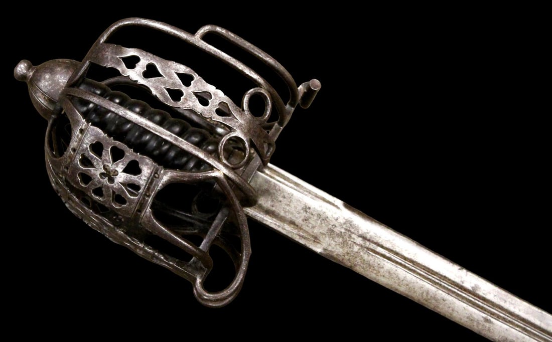 Rare 18th C. Scottish Glasgow School Basket Hilt Broad Sword.: Rare 18th C. Scottish Glasgow School Basket Hilt Broad Sword. A rare early example with fine fluted and pierced basket of the Glasgow School type, retaining its interior lining. Mounted with a single