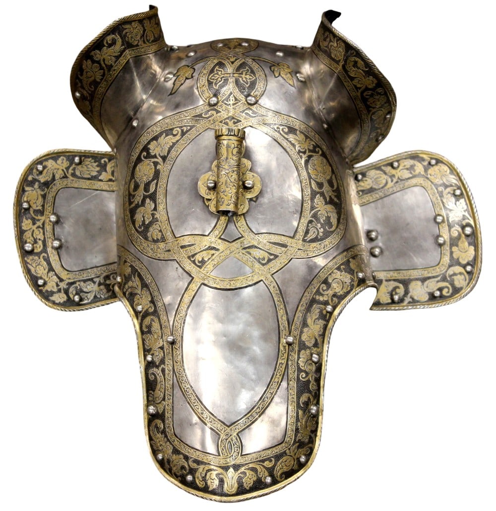A HIGHLY DECORATED ELECTROTYPE COPY OF A SOUTH GERMAN HALF SHAFFRON OF CIRCA 1560, 19TH CENTURY: A HIGHLY DECORATED ELECTROTYPE COPY OF A SOUTH GERMAN HALF SHAFFRON OF CIRCA 1560, 19TH CENTURY.Formed of a main plate with integral ear-pieces and pol-plate, fitted with a pair of hinged cheek-pieces