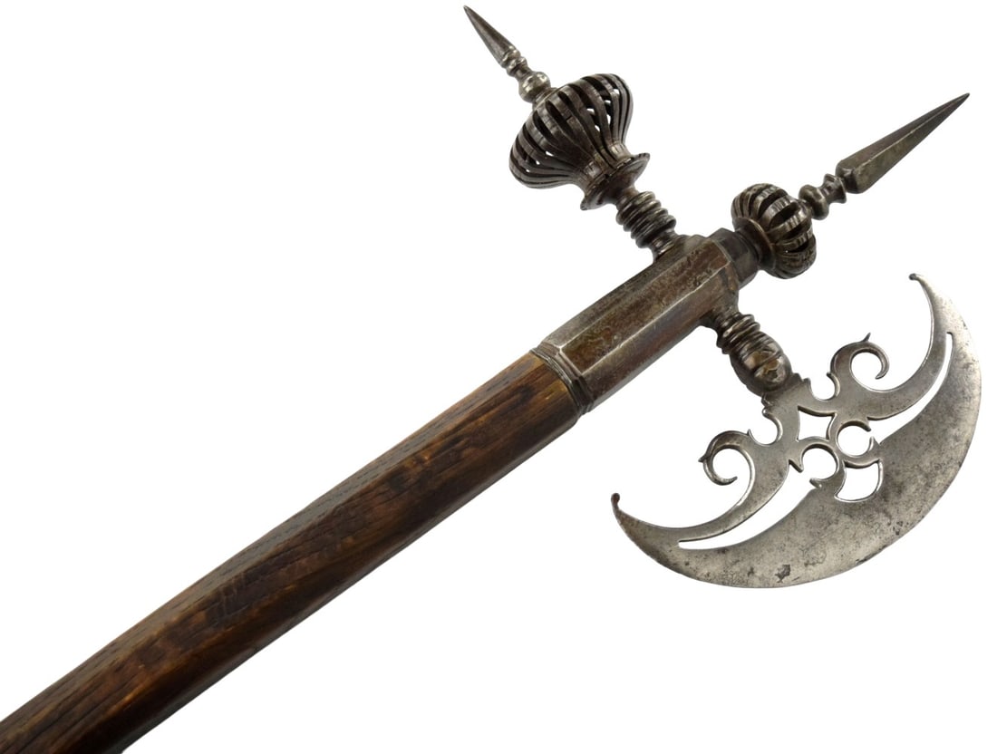 Superb Early 17th Century Fancy Poleaxe / Axe with Pierced Crescent Blade & Spiked Finials: Striking late 16th - early 17th axe/polearm featuring a broad crescent cutting blade with pierced and chiseled scrollwork to the interior, paired with an opposing square-section thrusting spike and an