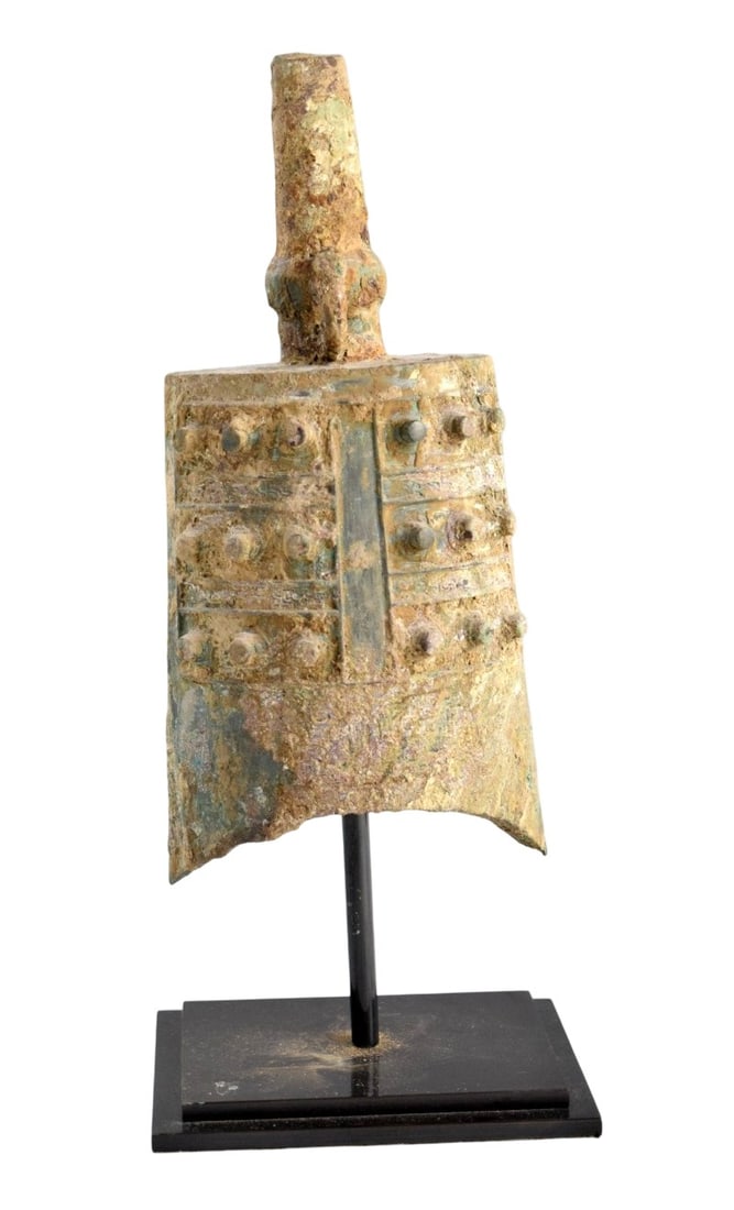 A Large Archaic Bronze Bell Yong Zhong Eastern Zhou Dynasty: A large archaic bronze bell Yong Zhong Eastern Zhou Dynasty. Provenance: private Asian antique collector estate, Denver, Colorado. Size: 14 1/4" x 5" with stand; 10 1/4" x 5" without stand. Detailed c