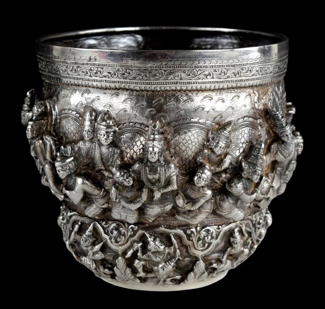 Antique Thai Burmese Silver Repousse Offering Bowl: This fine and unusual Burmese silver bowl is repoussed in high relief featuring scenes of what are probably from the Ramayana. These are surrounded by interlaced scrollwork. The upper border