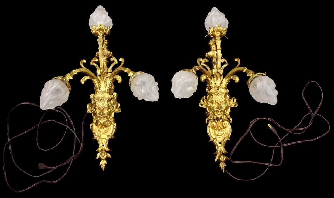 Pair of 19th Century Baroque Style Bronze Dore Sconces with Satyr Masks: Pair of 19th Century Baroque style dore bronze three light sconces with Satyr masks. These fine Paris-made wall lights feature finely-cast branches of serpentine form with bell shaped nozzles and