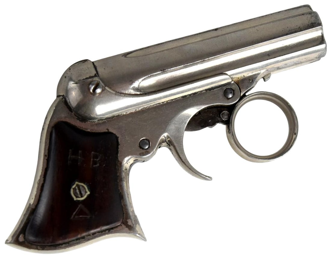 Remington-Elliot 5 Shot Ring Trigger Derringer: Short rimfire cartridge, 5 shot, 5 barrel cluster (fixed), 3 in. barrel cluster. Size: 4 3/4". For additional images please visit sofedesignauctions.com Approx. 10,000 produced (c
