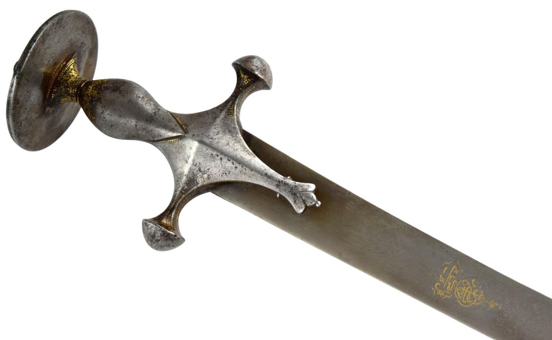 Fine 17th 18th Century Indo-Persian Tulwar with Wootz Steel Blade, Gold Koftgari Hilt & Gold-Inlaid: A fine Indo-Persian tulwar dating to the 17th–18th century, mounted with an elegant steel hilt richly decorated with gold koftgari inlay. The characteristic disc pommel, baluster grip, quillons, and