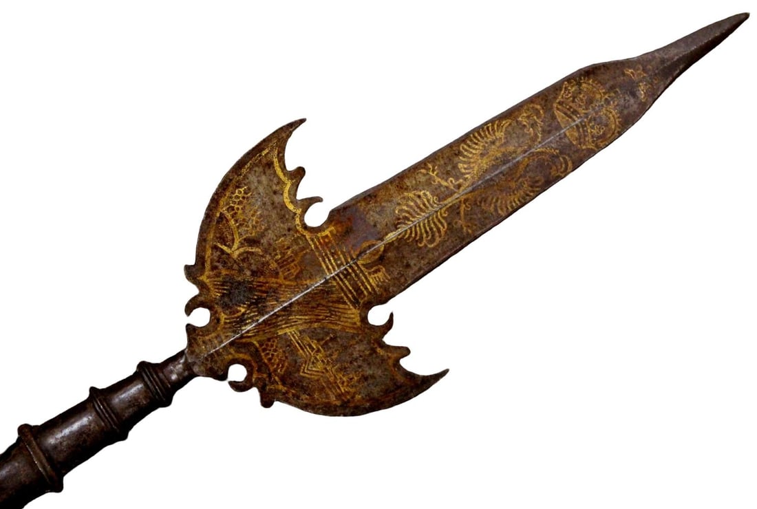 Excellent 16th Century Austrian Gilt & Engraved Halberd with Original Wooden Shaft: An excellent and highly decorative original 16th-century Austrian halberd retaining its original hardwood shaft. The finely forged head features a robust spear point, crescent axe blade, and rear hook