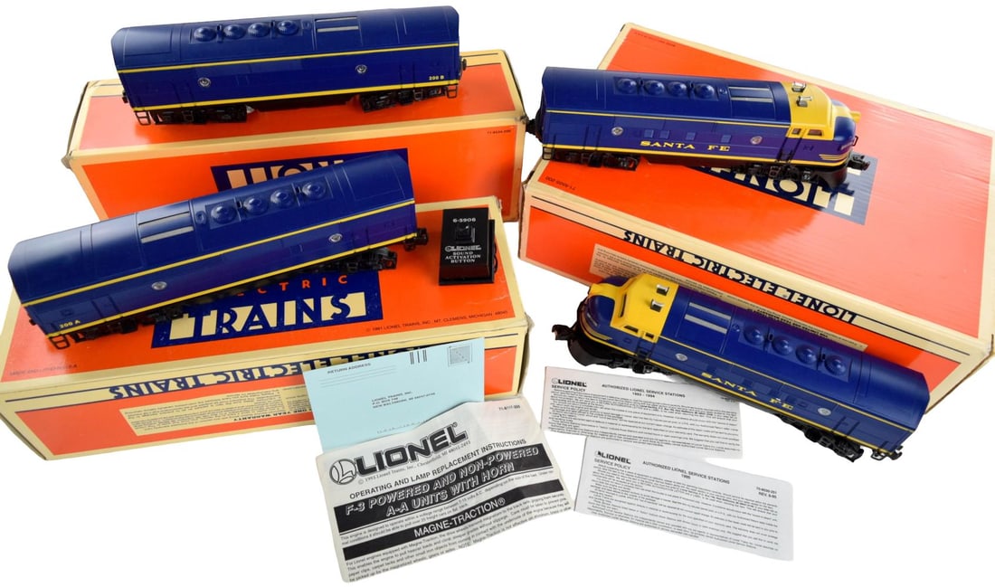 Lionel Electric Trains Santa Fe Blue/Yellow 4 Piece Set: Lionel Electric Trains Santa Fe Blue/Yellow 4 piece set. Two locomotives and 200A and 200 B cabs. New old stock, unused condition. Santa Fe 'Cat Wiskers' LEGACY F3 A-A Diesels (PWR #200, DMY #201). Th