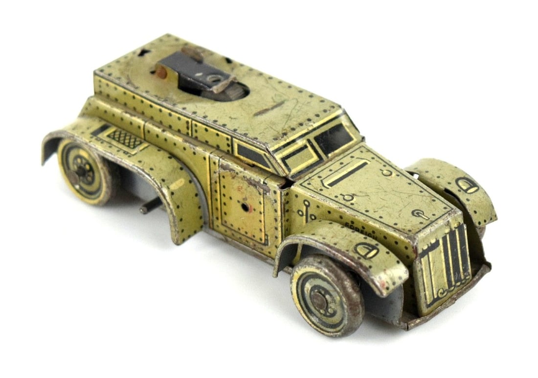 A GERMAN D.R.G.M. GAMA T56 TINPLATE CLOCKWORK TOY ARMED CAR: A GERMAN D.R.G.M. GAMA T56 TINPLATE CLOCKWORK TOY ARMED CAR. D.R.G.M. (Germany) Small Scale Armored Car (Mudguard Version) Tinplate Armored C with tin printed details. Clockwork drive (untested - no