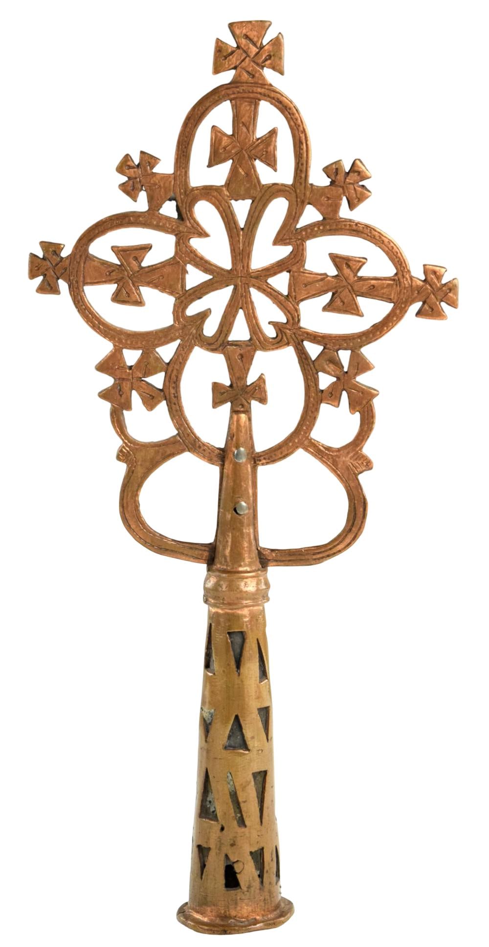 Ethiopian Orthodox Copper Alloy Cross: Processional crossesâ??distinctive symbols of Ethiopian Christianityâ??are carried on staffs during religious ceremonies and festivals. This example, cast in copper, features a four-lobed (quatrefoi