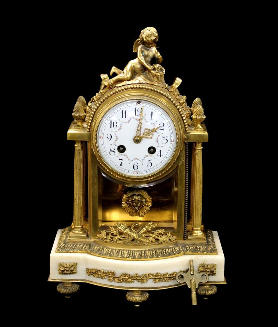 Louis XVI Style Cupid Patinated Bronze Clock: Louis XVI Style Cupid Patinated and Gilt Bronze Clock, late 19th century, the circular enamel painted dial, with strike on bell movement, decorated with cupid figure on top. Size: 14 1/4" x 9 1/4" x 4