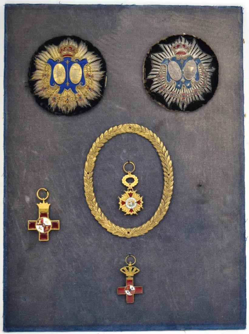 Lot of Five Spanish Kingdom Medals Badges Orders: Among those Two Spain, Kingdom. A Military Body Of Justice, Embroidered Judge Breast Badges, Miniature Belle Medal and Two Crosses of Military Merit. Civil war Era. Board Dimensions: 14 1/2" x 10 3/8"