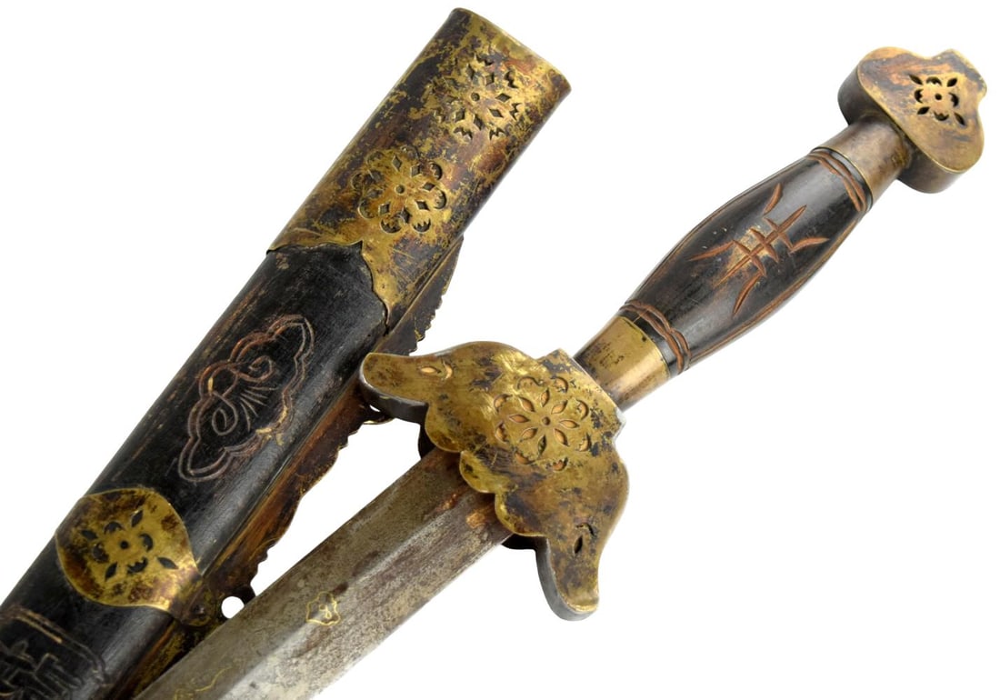 ANTIQUE CHINESE LATE QING DRAGON DECORATED JIAN SWORD: China, late Qing Dynasty, circa 1890 - 1910. An attractive antique Chinese jian, or straight double-edged sword, dating to the closing years of the Qing Dynasty. The substantial straight steel blade i