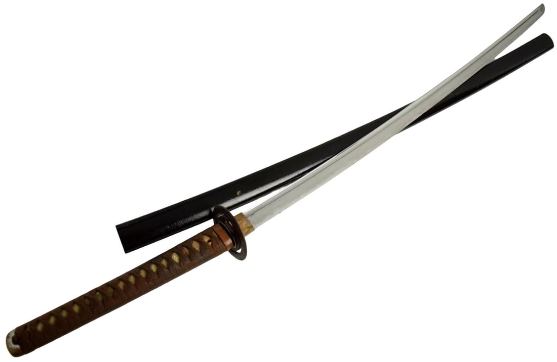 Early 1600's Shinto katana, 29 inch length of cutting edge, signed Dewa Daijo Fujiwara Kunimichi: Shinto katana, 29 inch length of cutting edge, signed Dewa Daijo Fujiwara Kunimichi, this is the top student of Horikawa Kunihiro, ca. early 1600's. The blade shows deep bo-hi grooves and a very refin