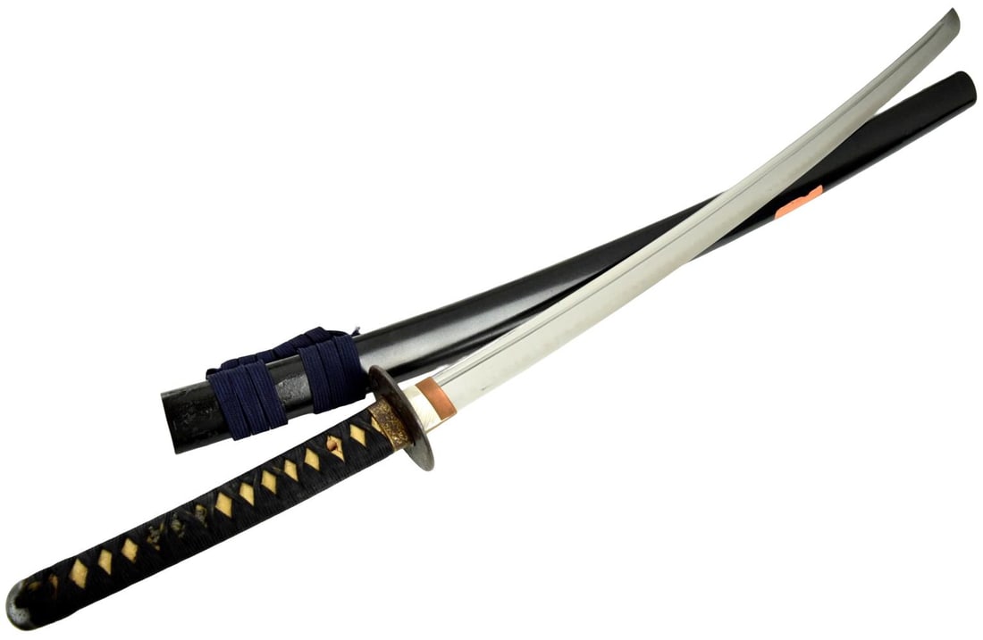 Shinto katana, 26 and 1/2 inch length of cutting edge. A powerfully shaped katana with a rare: Shinto katana, 26 and 1/2 inch length of cutting edge. A powerfully shaped katana with a rare cutting test. The blade is signed Echizen Koku Shimosaka Tsugutoshi, ca. 1600's. The blade is also signed 