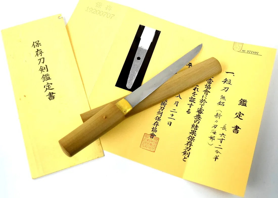 Antique Japanese Tanto Knife with NBTHK Tokubetsu Kitcho Certificate: Antique Japanese Tanto Knife. Blade tang stamped at the top. Comes with NBTHK Tokubetsu Kitcho Certificate. nbthk paper attribution says: "mumei, shinshinto hamabe"; attributing the tanto to the Hamab