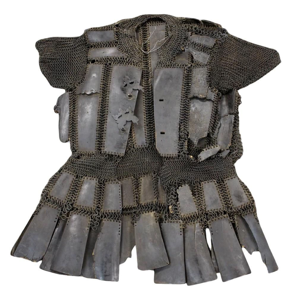 Very Rare 19th Century Indonesian Armor Metal & Horn Lamellar: A rare and visually striking 19th century Indonesian suit of armor, crafted in a traditional lamellar construction using interlocking metal plates combined with carved horn panels. The plates are arra