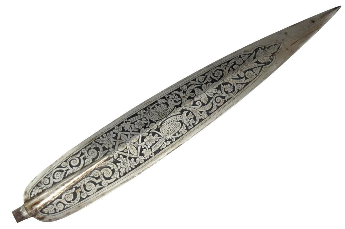 Rare Antique Burmese Silver-Inlaid Spearhead, late 19th Century: Antique Burmese spearhead of elongated leaf form, forged in steel with a pronounced central rib and sharply tapering point. The face is extensively decorated with finely worked silver-colored inlay or