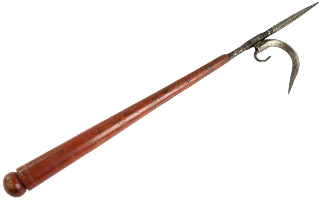 Fine 19th Century Indian Ankus Elephant Goad: A fine antique Indian ankus, or elephant goad, of traditional form, comprising a long reddish-brown wooden haft 23 1/2 inches long fitted with an iron head. The head incorporates a long faceted spear-