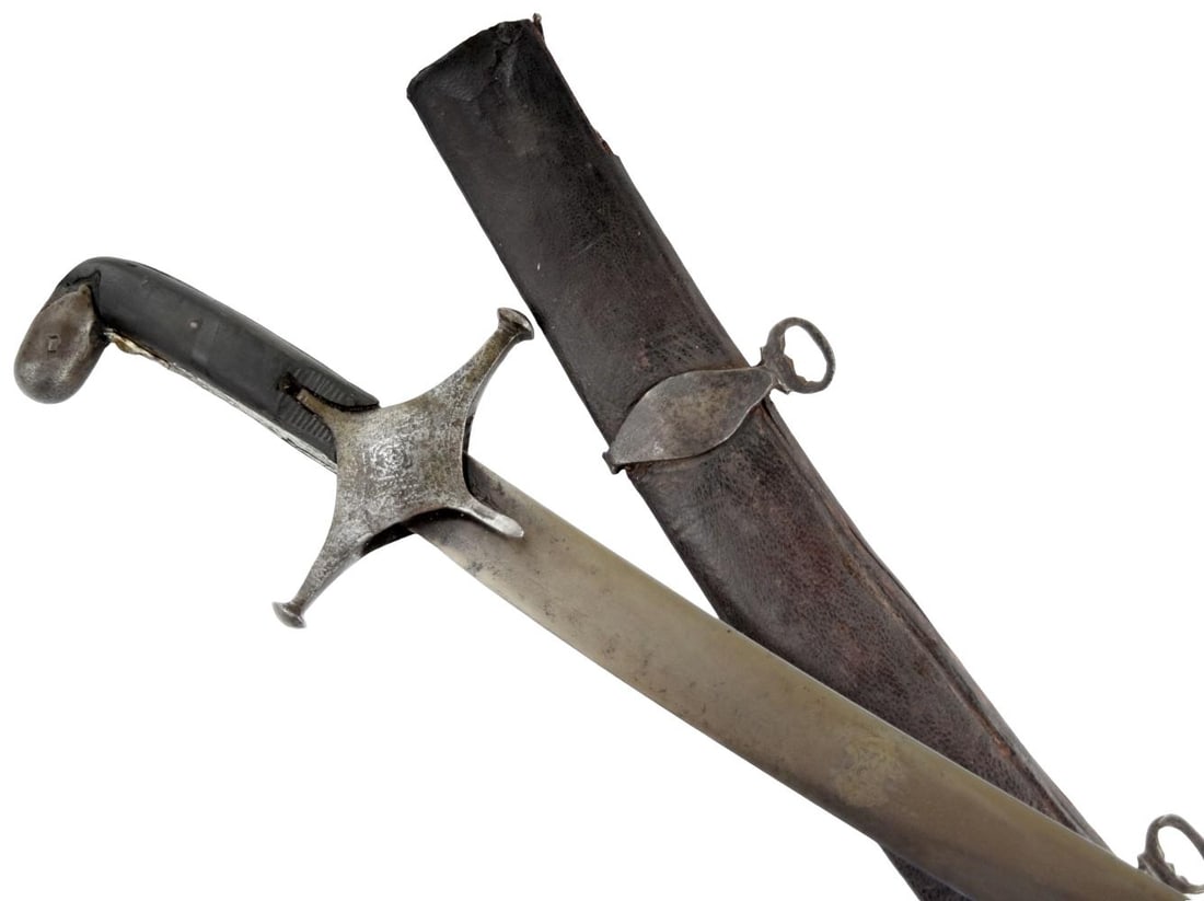 18th Century Persian or Syrian Shamshir with Damascus Steel Blade: An antique Persian or Syrian shamshir of characteristic deeply curved form, mounted with a broad single-edged Damascus or watered steel blade tapering gradually toward a narrow upswept point. The blad