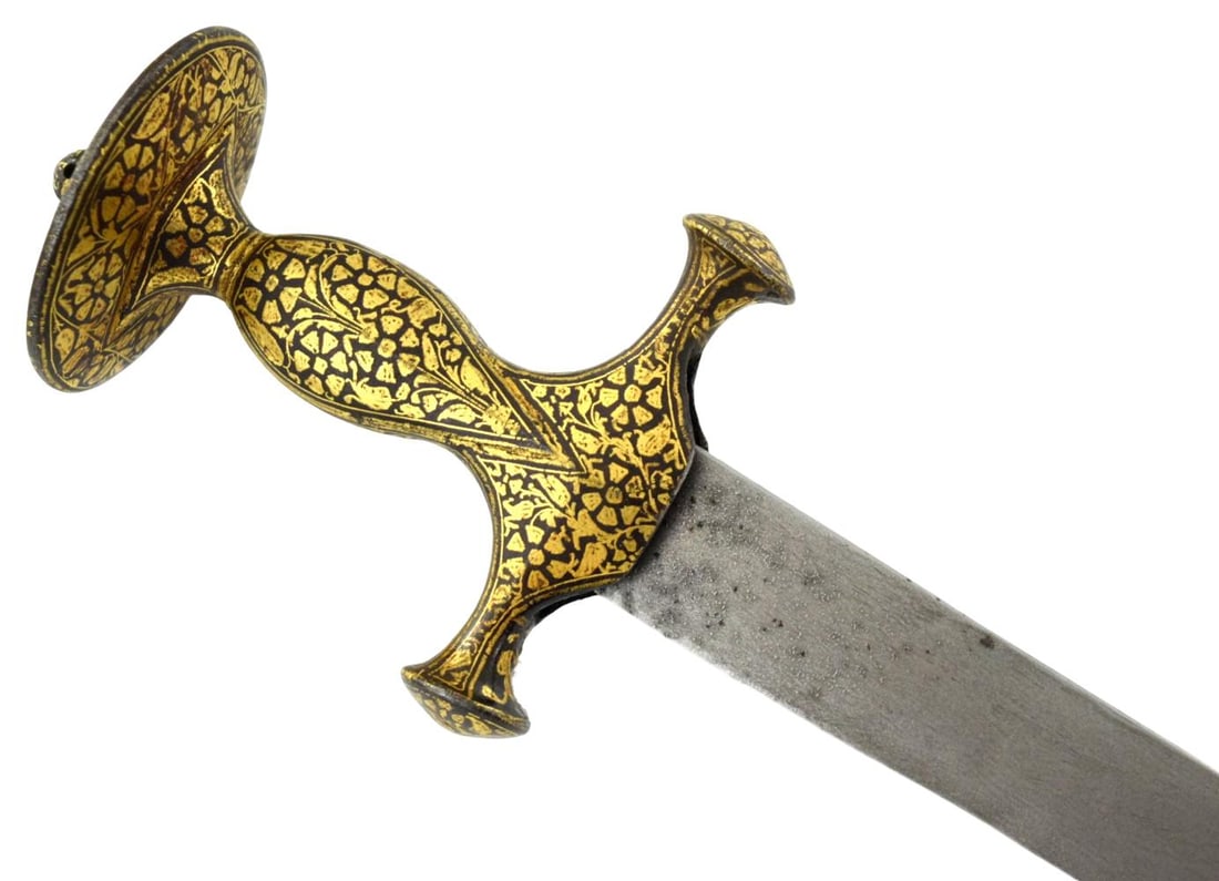 Fine Antique Indian Tulwar Sword with Elaborate Gilt Koftgari Hilt, 18th Century: A fine antique Indian tulwar featuring an exceptionally well-decorated all-steel hilt covered with extensive gilt koftgari ornamentation. The hilt is of classic tulwar form with disc pommel, swelling 