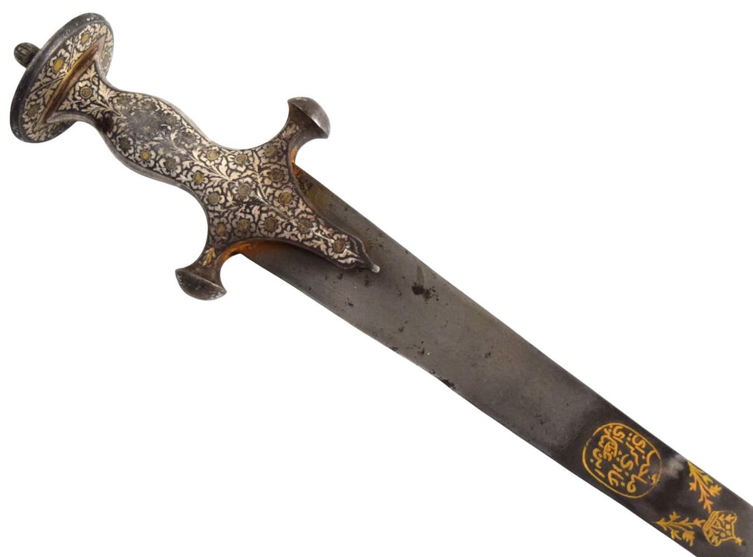 18th Century Indo-Persian Tulwar with Damascus Shamshir Blade, Gold Inlaid Calligraphy and Silver &: A finely decorated 18th century Indo-Persian tulwar mounted with a strongly curved shamshir-form Damascus steel blade. The blade displays a pronounced sweeping profile and is embellished on both sides