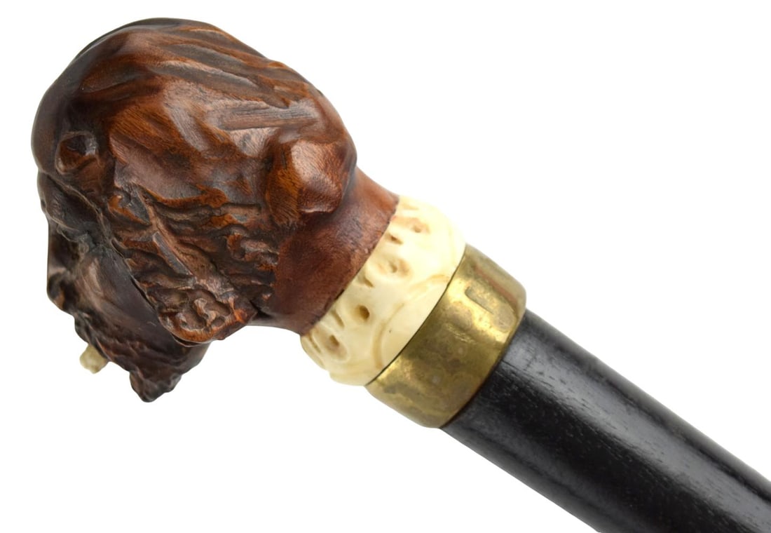 Antique Hand Carved Man's Head Walking Cane: A 19th century walking stick or cane, the pommel carved as the head of a man. Total length: 34", head: 2 1/2" x 3" For additional images please visit sofedesignauctions.com Detai