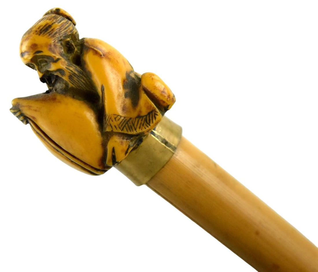 Japanese Bamboo Walking Stick With Netsuke Handle: Japanese bamboo walking stick with carved signed netsuke handle. Total length: 30" For additional images please visit sofedesignauctions.com Detailed condition reports are not inc
