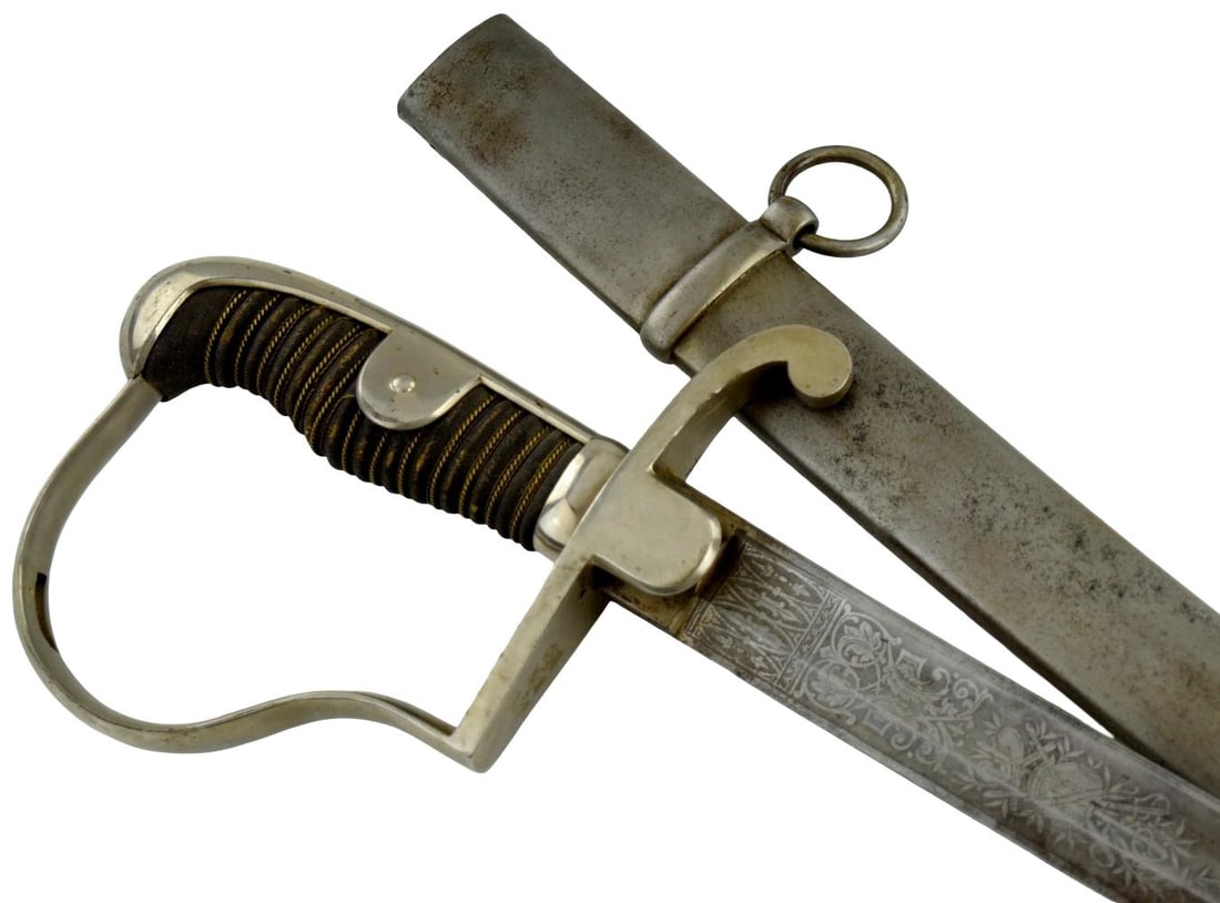 Imperial German WWI NCO Cavalry Sword with Etched Blade & Steel Scabbard: An attractive Imperial German cavalry sword dating to the late 19th or early 20th century, including the World War I era, likely intended for an officer or senior NCO. The sword is fitted with a long,