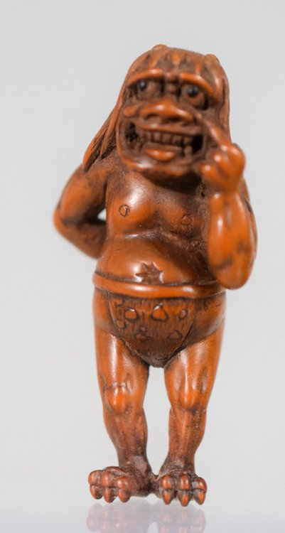 Japanese Edo period standing Oni netsuke: Antique Japanese Edo period wood carved standing Oni netsuke. 56 mm high x 29 mm wide x 21 mm long.