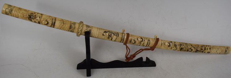 Highly decorated Japanese Sword with carved Bone handle: Highly decorated Japanese Sword with carved Bone handle, scabbard and mounts. Total length is 33.5", blade - 17.25"