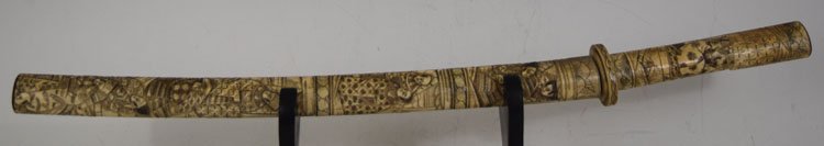 Highly decorated Japanese Sword with carved Bone handle: Highly decorated Japanese Sword with carved Bone handle, scabbard and mounts. Total length is 28", blade - 18". Being sold without stand.