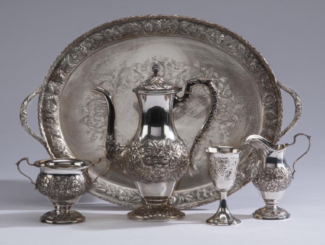 (5) S. Kirk & Son sterling Repousse hot beverage set: Five piece grouping S. Kirk & Son sterling silver hand chased Repousse' diminutive hot beverage service, having (4) pieces comprising: (1) teapot with an artichoke finial above a baluster form body wi