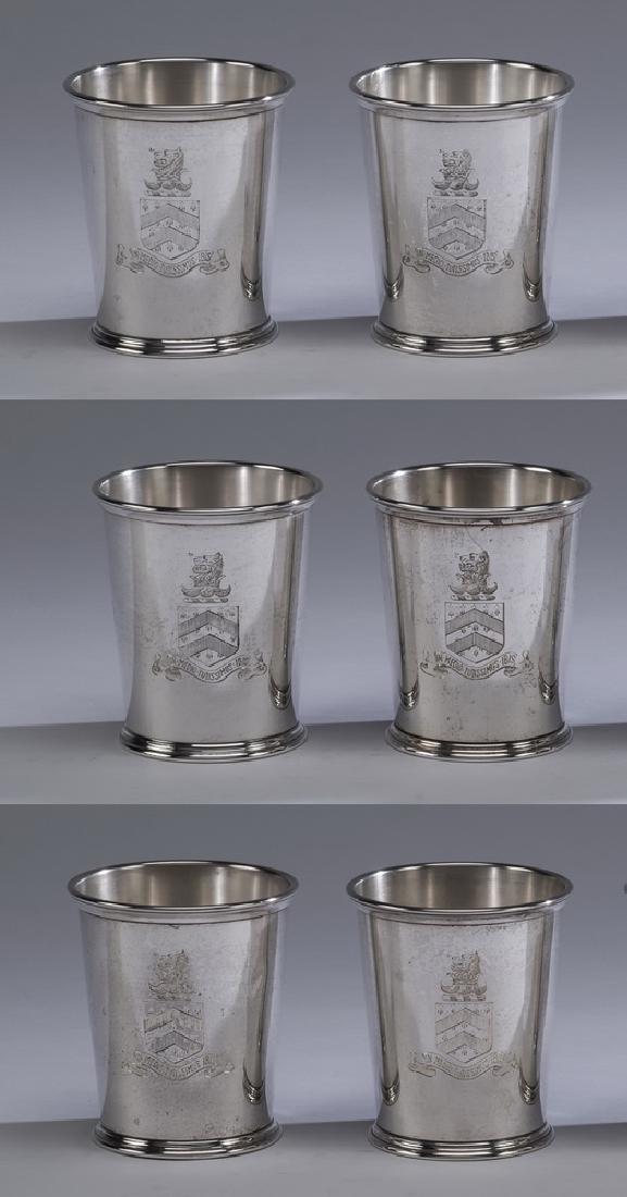 (6) S. Kirk & Son sterling silver julep cups, 4"h: (6) S. Kirk & Son sterling silver julep cups, of typical form, each engraved with a family crest depicting a lion over a shield with a ribbon underneath having a Latin quotation from Ovid, 'In Medio T