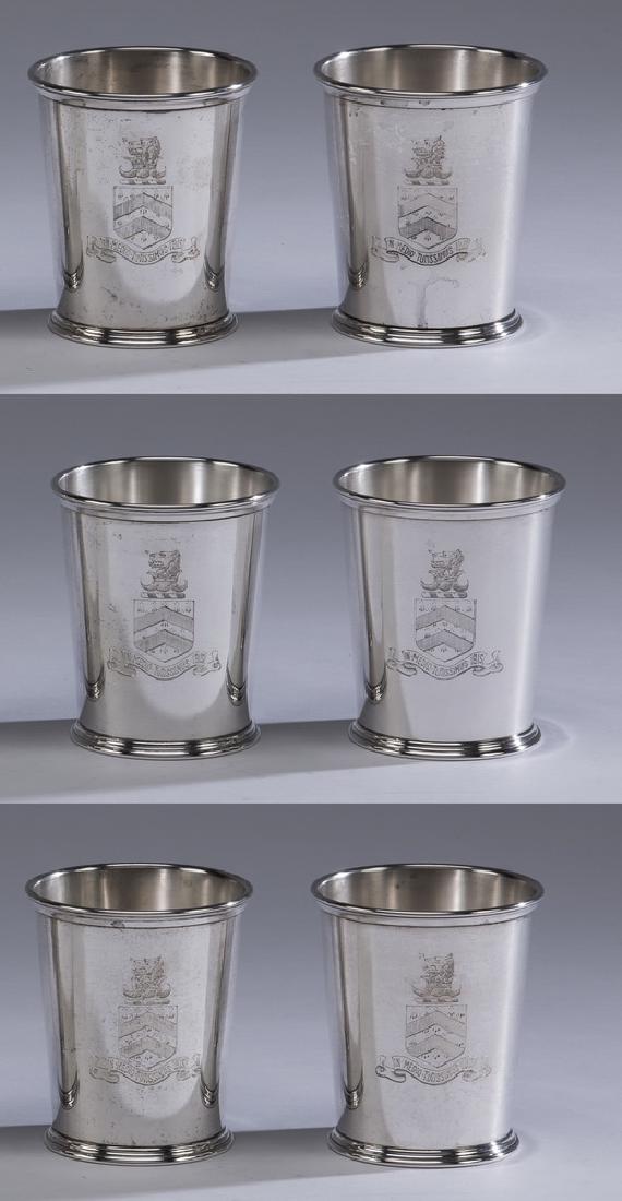 (6) S. Kirk & Son sterling silver julep cups, 4"h: (6) S. Kirk & Son sterling silver julep cups, of typical form, each engraved with a family crest depicting a lion over a shield with a ribbon underneath having a Latin quotation from Ovid, 'In Medio T