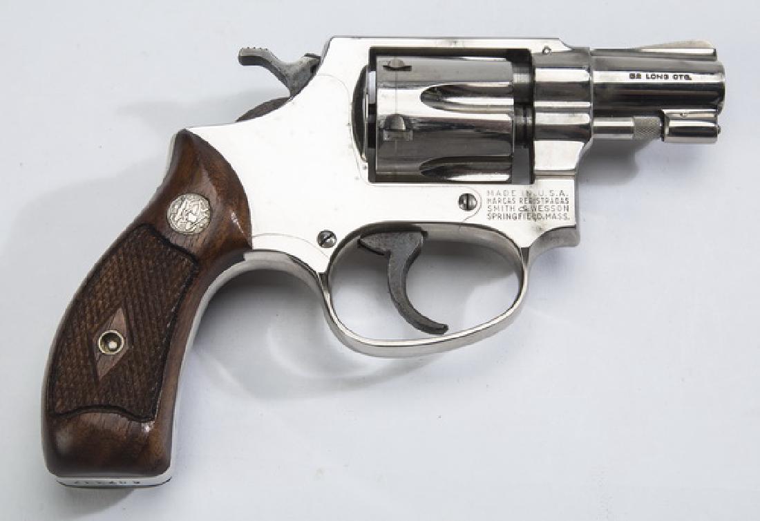 Smith & Wesson .32 caliber snub nose revolver, 7"l: Smith & Wesson Pre model 30, .32 caliber snub nose revolver, circa 1956, the six shot, double action hand ejector, having an 'I' frame, a pinned 2"l barrel, and nickel finish, ending in checkered waln